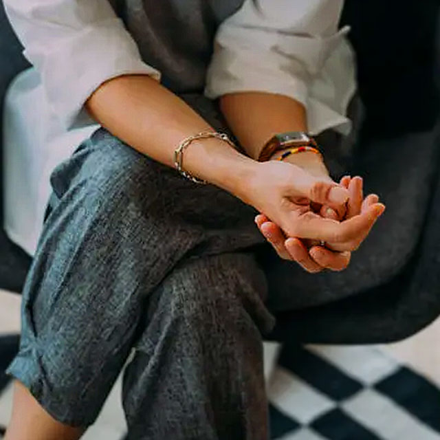 Photo Woman Sitting Hands in Lap